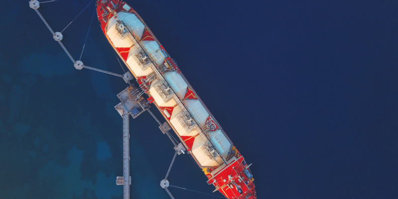 High angle view of an LNG Tanker moored to the jetty to supply Liquified Natural Gas to the Power Station.