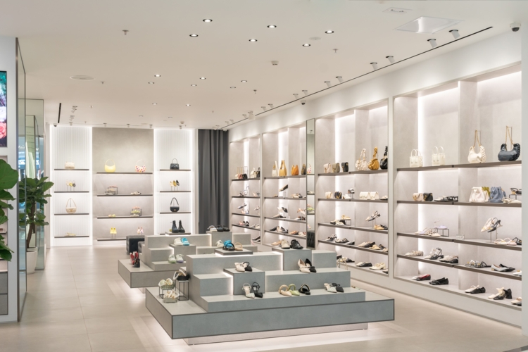 A luxury retail fashion store with white interior
