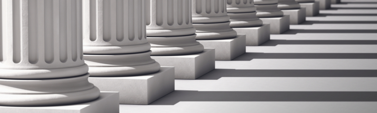 A row of columns diminishes to the vanishing point and out of focus.Computer Generated for perfect shadow angles and crisp columns.