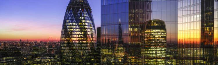UK, London, digital composite of modern skyscrapers in the financial district viewed from high up, illuminated at dusk
