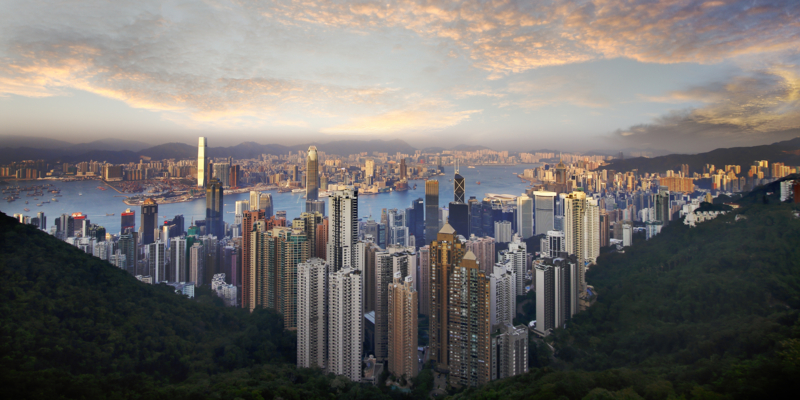 A beautiful scenery seen from Hong Kong Victoria peak with the unique cluster architectures building during sunrise with vista overlooking across the glittering concrete city of it many iconic landmark tower and skyscrapers with high rise apartment blocks towards Kowloon view taken by my canon 6D during December 2017 holiday trip , China.