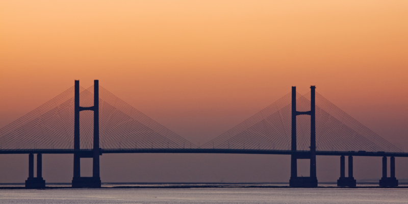The central towers of the second road bridge connecting England and Wales over the river Severn at dusk in winter